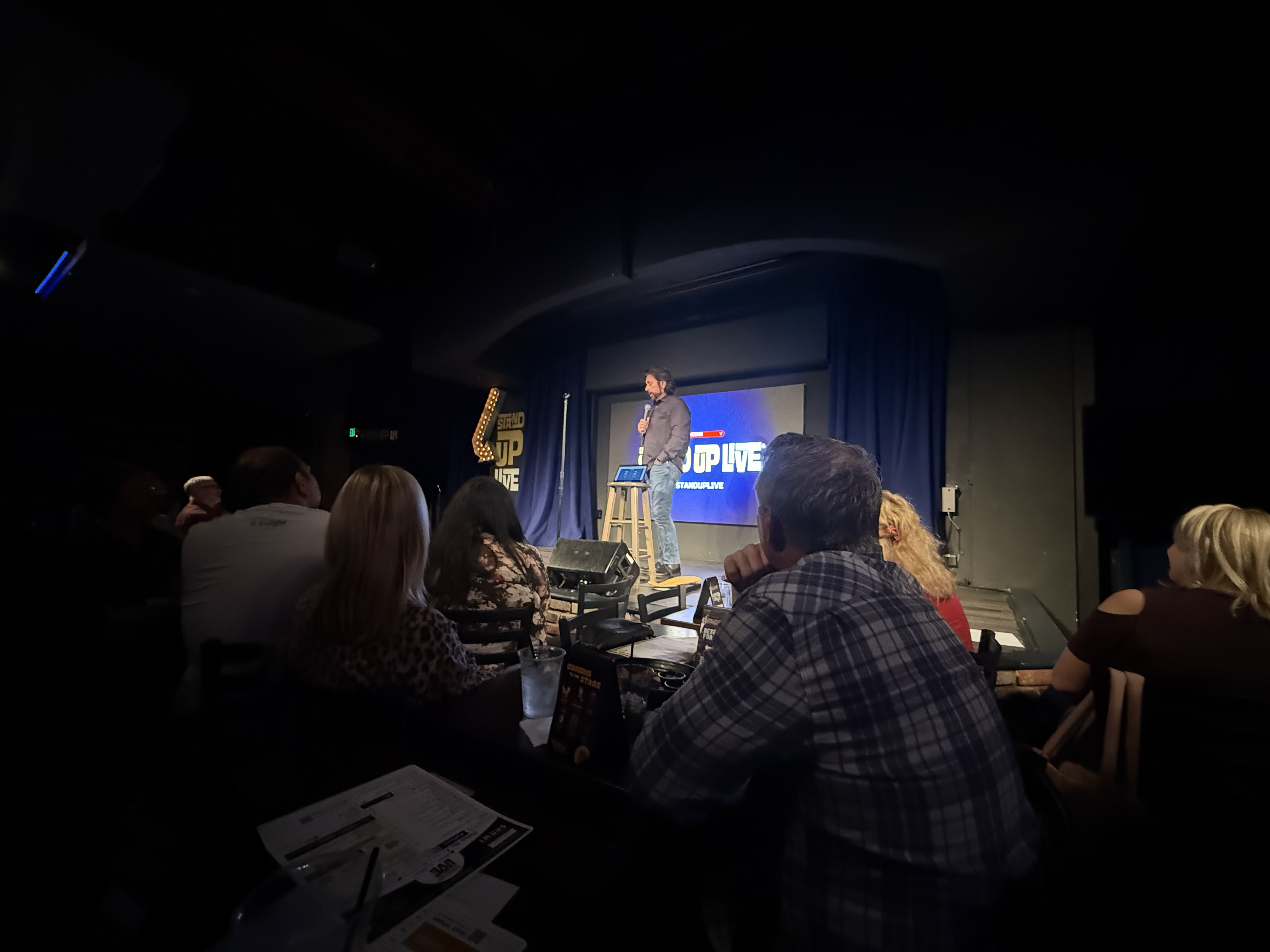 Dennis Bonilla performing stand-up comedy at Stand Up Live