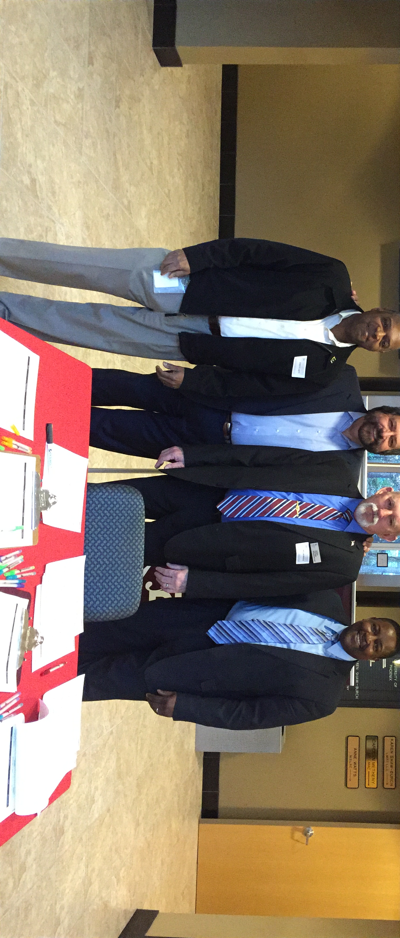 Dennis Bonilla with University of Phoenix colleagues
