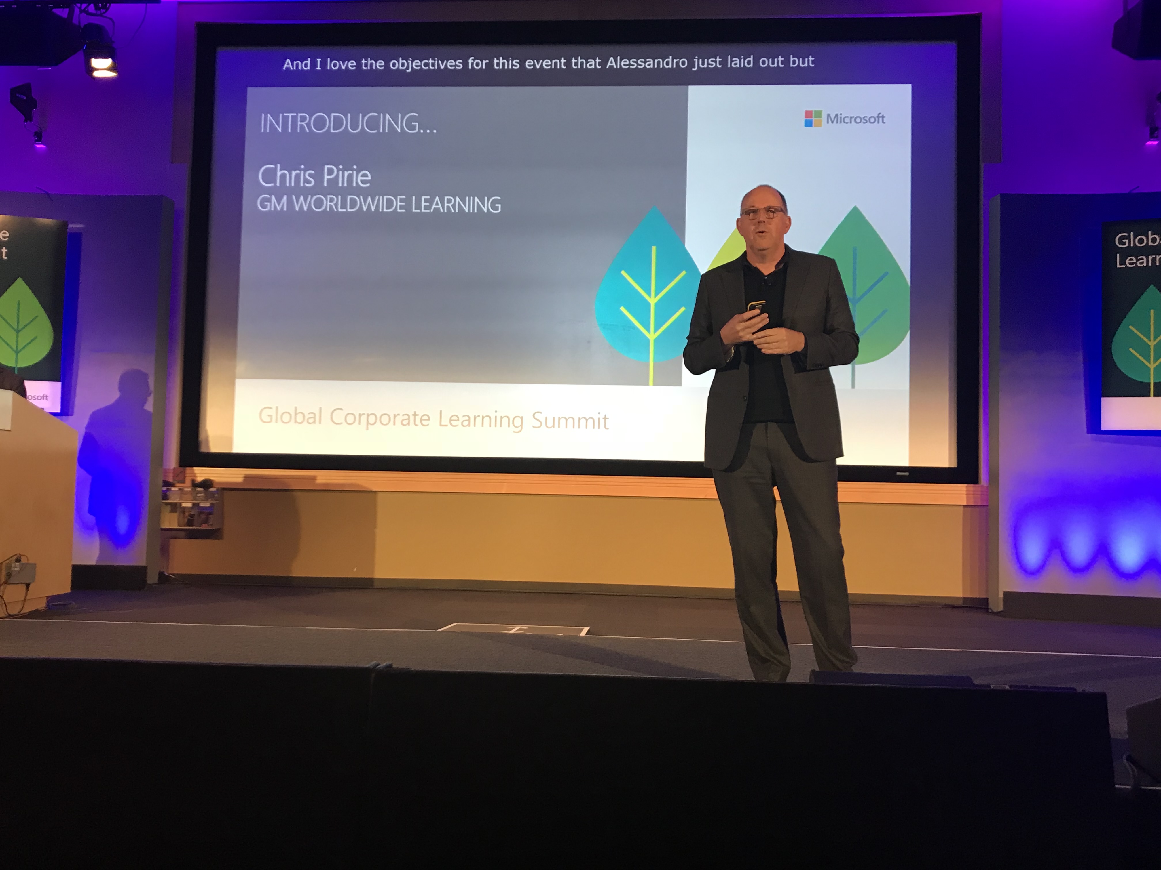 Speaker introducing Chris Pirie at the Global Corporate Learning Summit