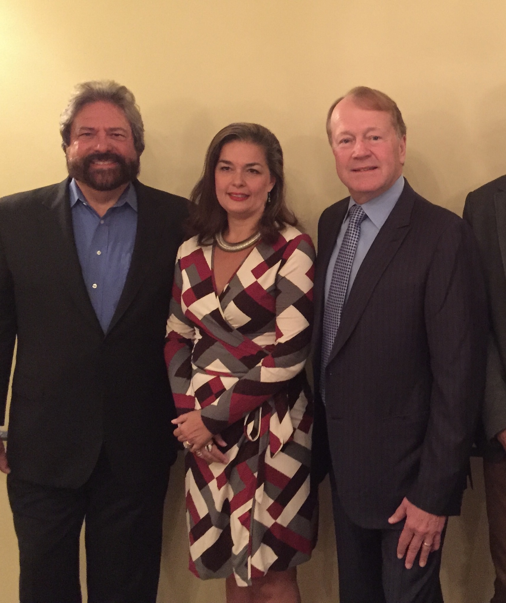 Dennis Bonilla with colleagues at an evening reception