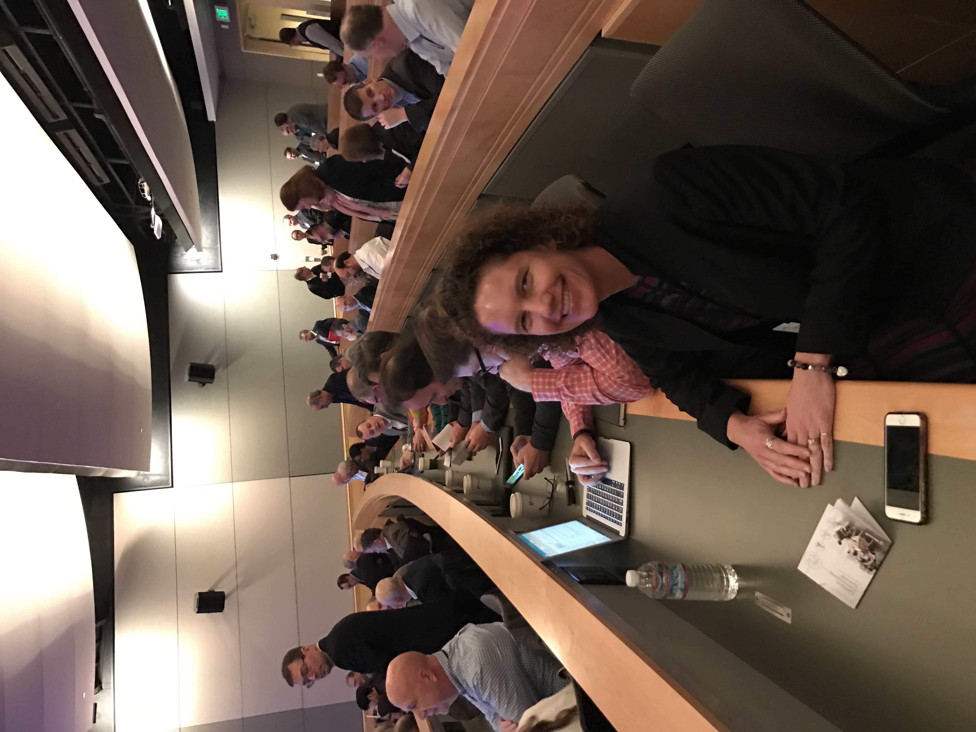 Attendee smiling at a corporate learning conference session