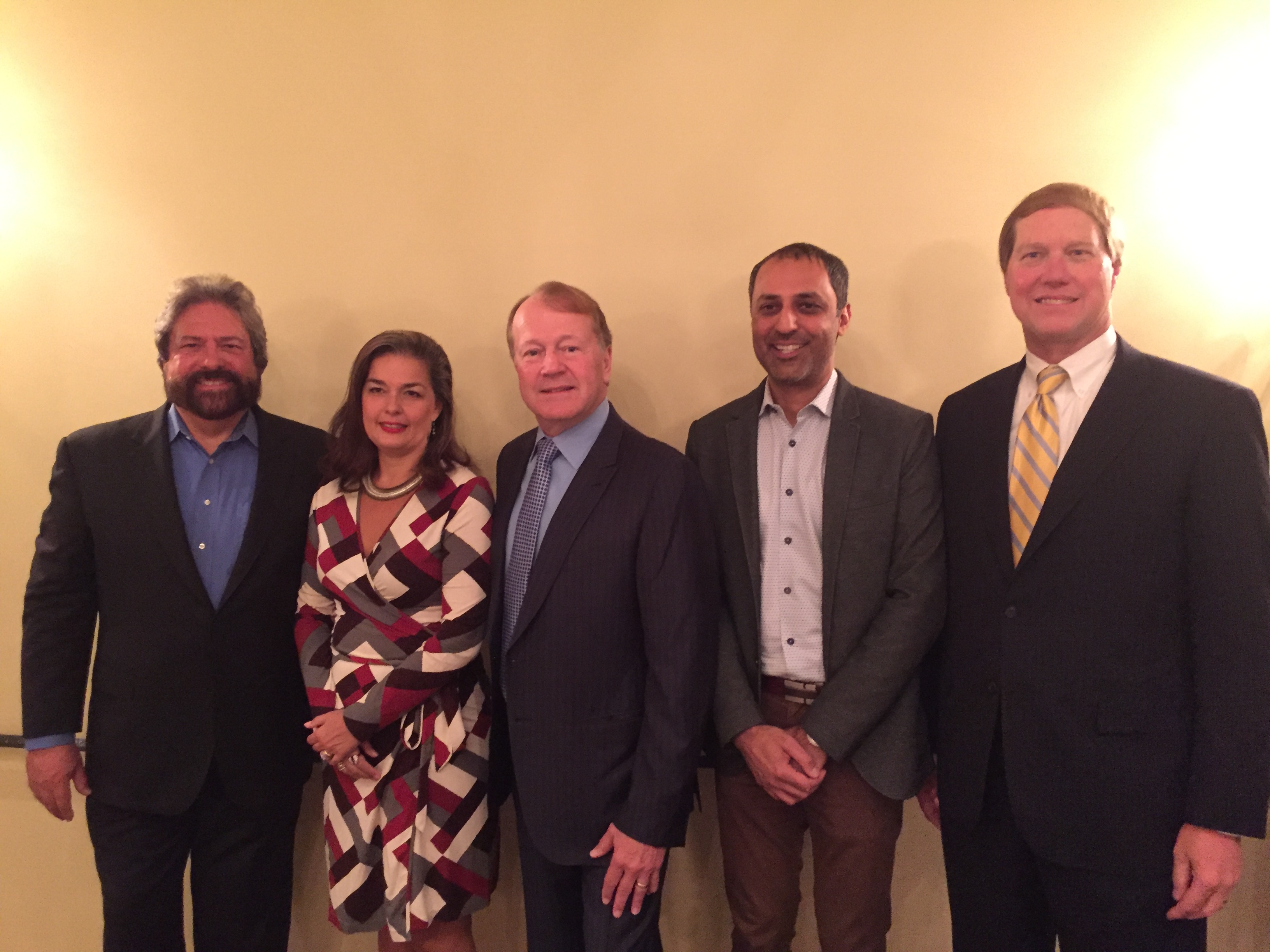 Dennis Bonilla with colleagues at an evening event