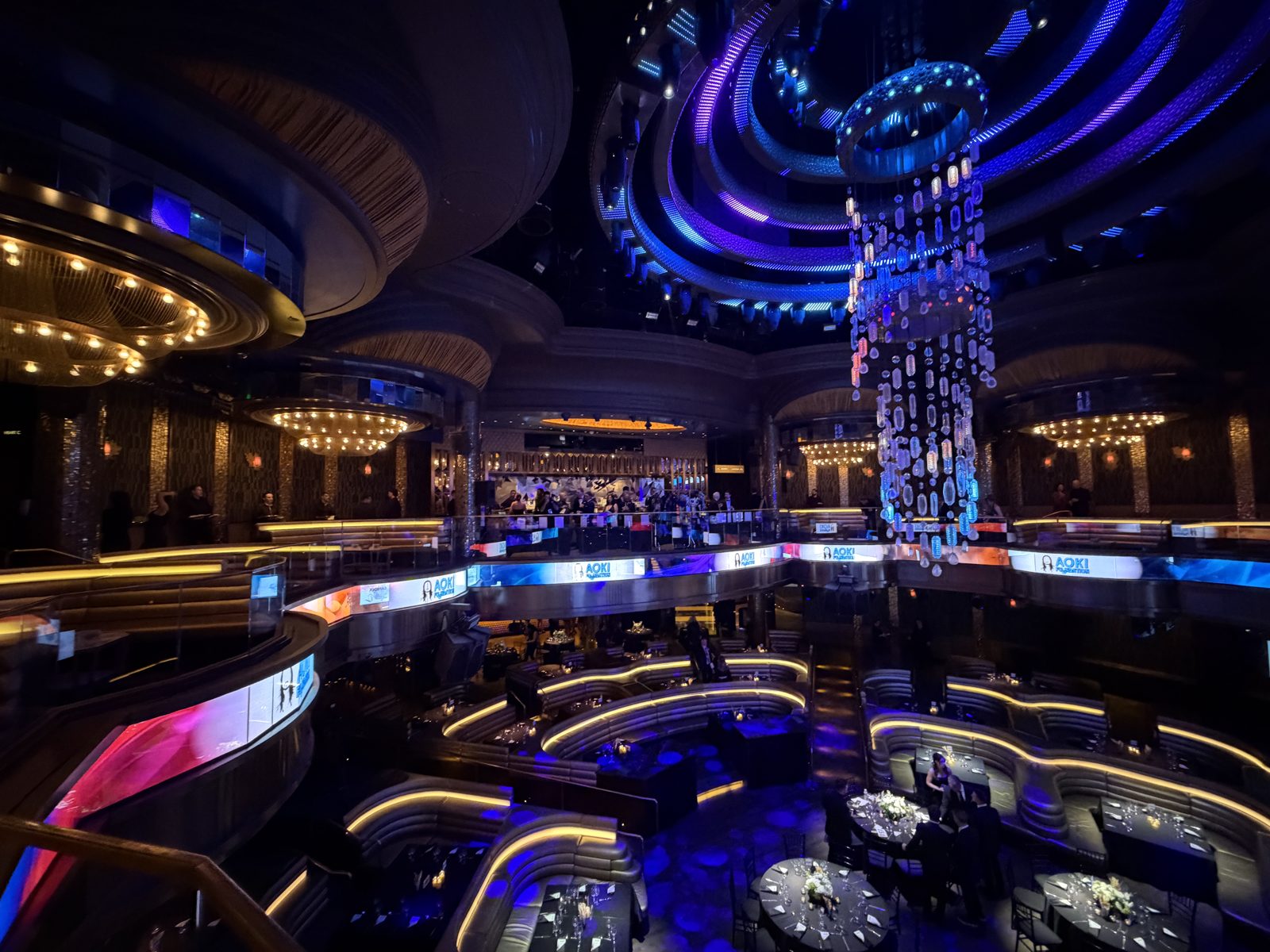 Aerial view of the Aoki Gala ballroom with dinner tables and stage lighting
