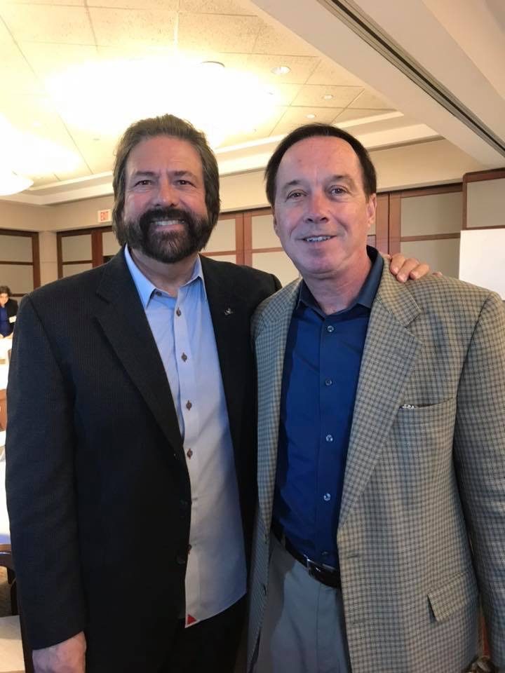 Dennis Bonilla with a colleague at a conference