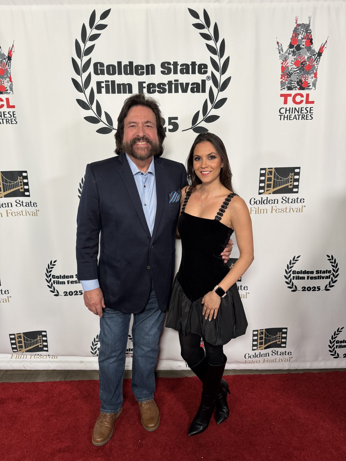 Dennis Bonilla with a guest on the red carpet at the 2025 Golden State Film Festival